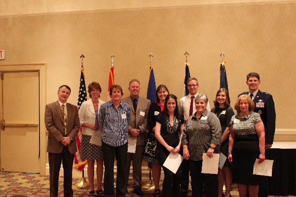 In May, attendees of the scholarship dinner are (l-r) Col. Pohlmann; chapter grant winners Starla Deeds, Rachel Paul, Derek Stach, Kathy Snider, Jennifer Gregg, Tim Hughes, Sandy Canellas, Kristi Follett and Karen Leidecker; and Gen. Dickinson.